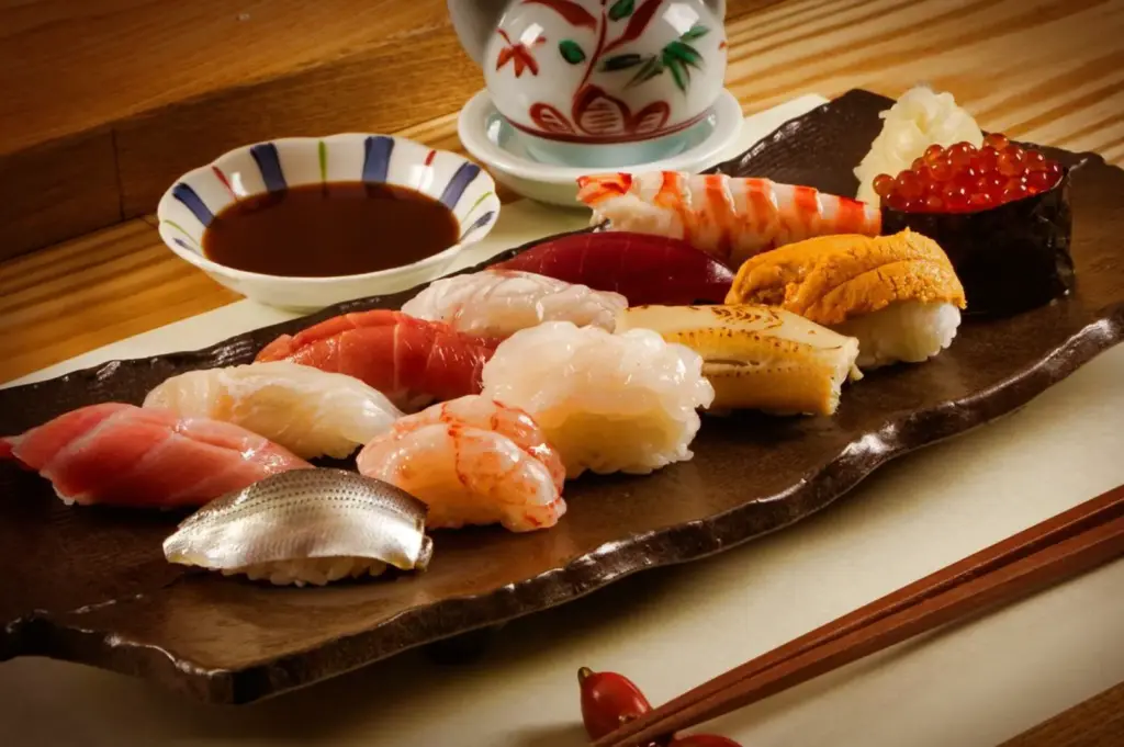 An exquisite selection of freshly prepared omakase nigiri on a traditional platter, showcasing the seasonal highlights of Singapore's finest dining experiences, featuring vibrant, high-quality seafood and seasonal ingredients meticulously chosen by the chef.