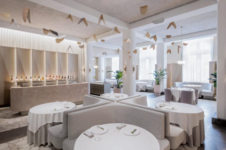 Odette three‑Michelin‑star restaurant interior at Singapore’s National Gallery with refined neutral tones, minimalist decor, and curated art.