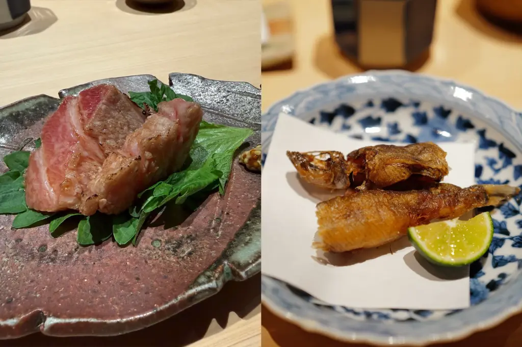 Exquisite Japanese dishes served at Sushi Zen Singapore, including seared wagyu beef on shiso leaves and crispy fried fish, representing the diverse flavors of their elevated Omakase menu.