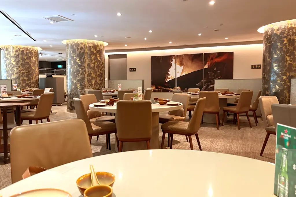 The modern and welcoming interior of Jia Wei Chinese Restaurant at Grand Mercure Singapore Roxy, designed for culinary experience and comfortable long conversations when group dining.