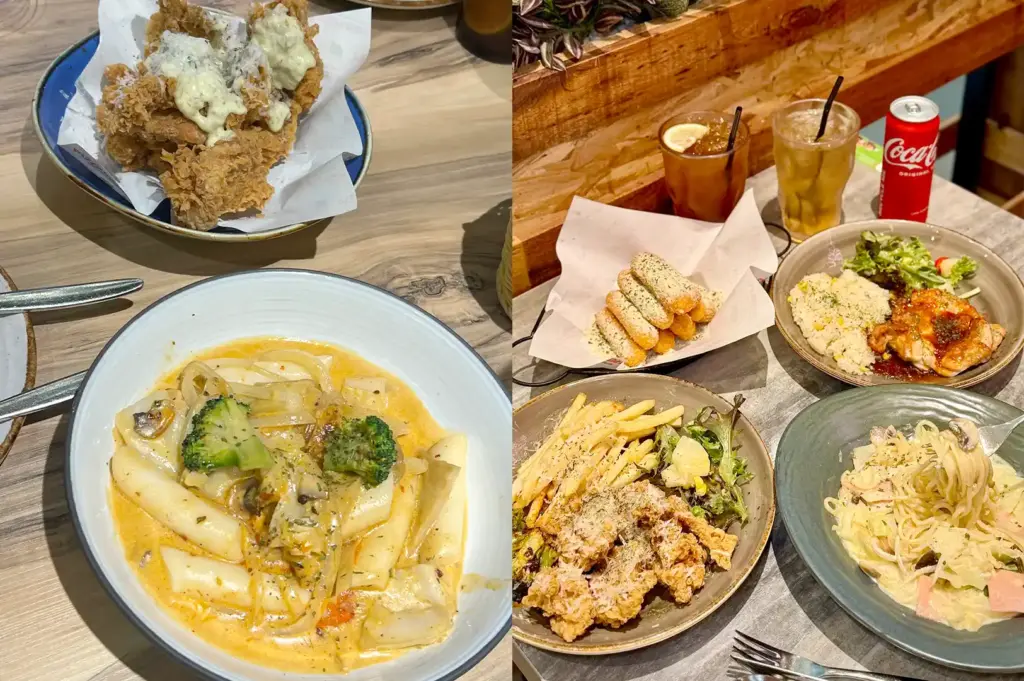 A spread of Korean comfort food dishes at Pizza Maru, featuring creamy rose tteokbokki, fried chicken, pasta, and baked rice.