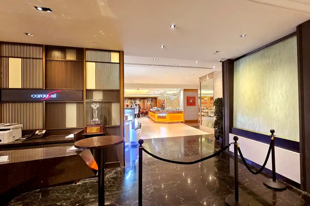 Entrance reception counter and welcoming lobby leading into Carousel Buffet at Royal Plaza on Scotts along Orchard Road.